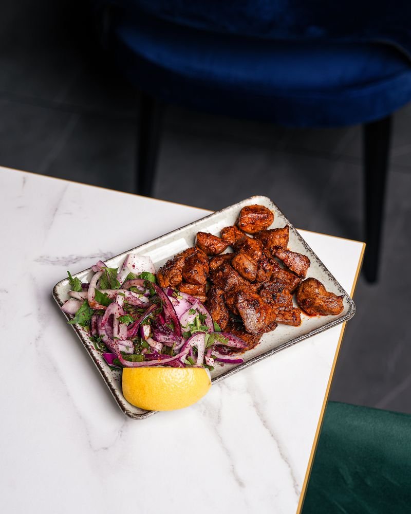 Arnavut cigeri — diced lamb liver with red onion and lemon